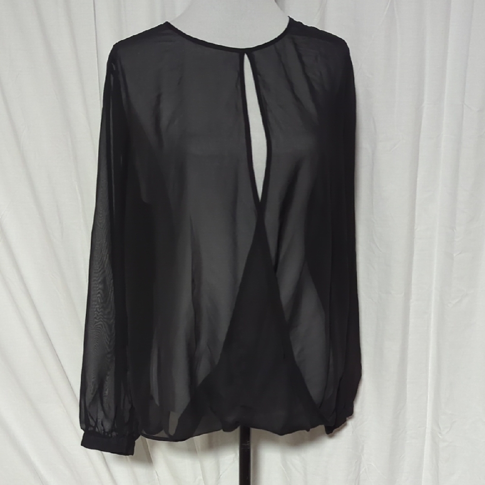 Jennifer Lopez Black Blouse with Sheer Elegance